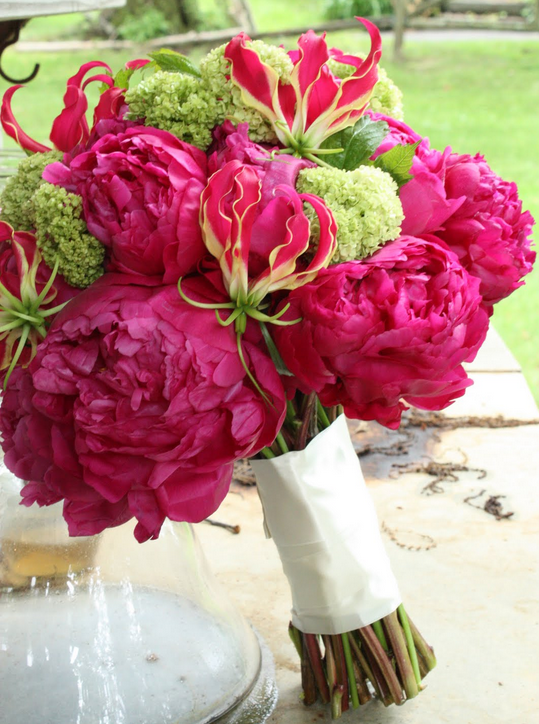 Modern wedding bouquet with hot flowers and green flowers.PNG