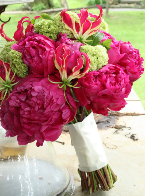 Modern wedding bouquet with hot flowers and green flowers.PNG