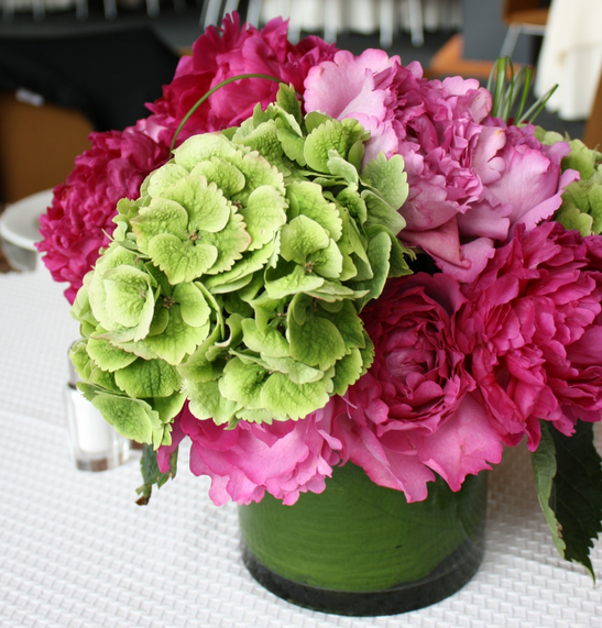Photo of modern chic center piece wit green and pink flwoers.PNG