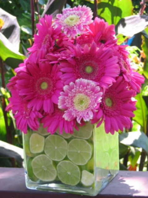 Pink flowers center piece with lemons in the vase water.PNG