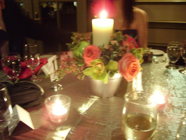 center pieces for wedding reception with roses and candles.jpg