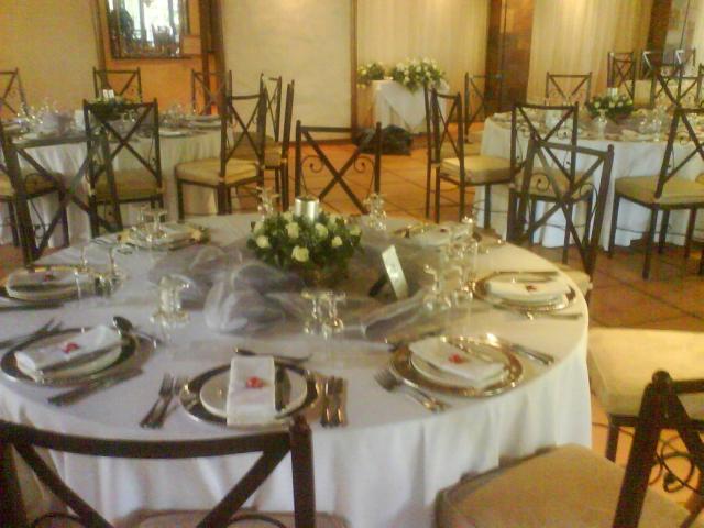 wedding flowers center pieces with white roses.jpg