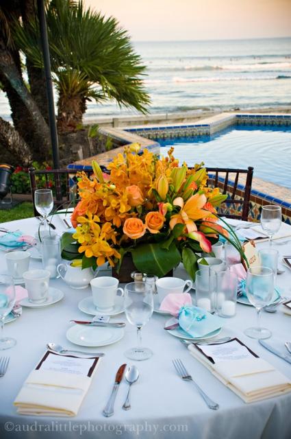 Wedding table center piece with orange flowers.jpg