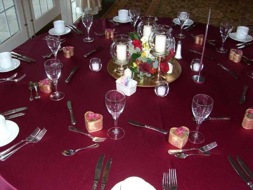 simple wedding center pieces with white candles.jpg