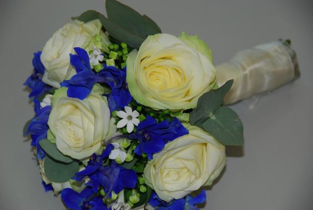 Fashion brides bouquet with cream roses, white and blue flowers.jpg