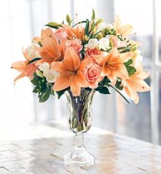 Peach arrangement with lily, peach roses and white flowers with glass vase picture.JPG