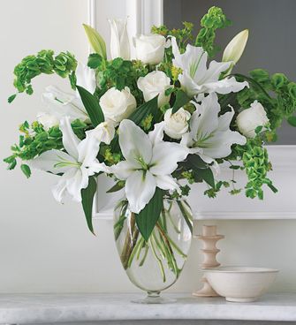 Pure white arrangement with lilies and white roses picture.JPG