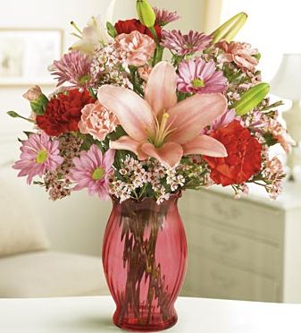 Red and pink passion arrangement in red vase image.JPG