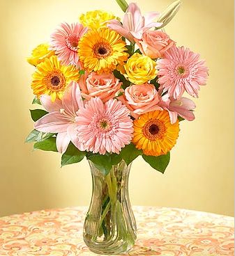 Yellow and peach flowers arrangement  with glass vase.JPG