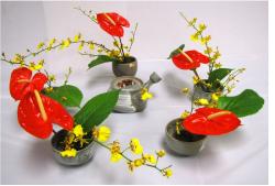 Beautiful Japanese arrangements with red and yellow flowers and green leaves.JPG